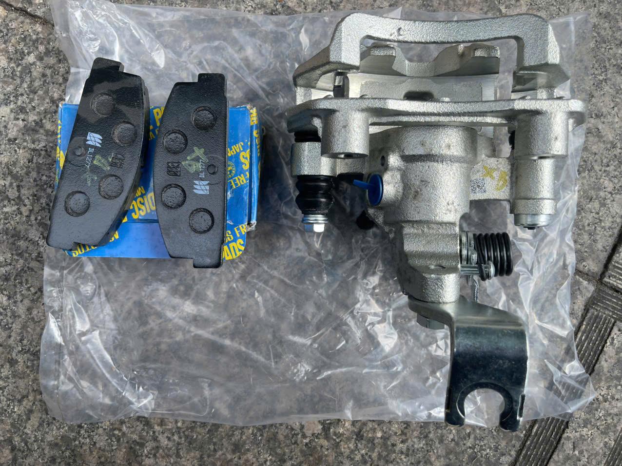 Cùm thắng sau Ford Laser 1.8 LH TH