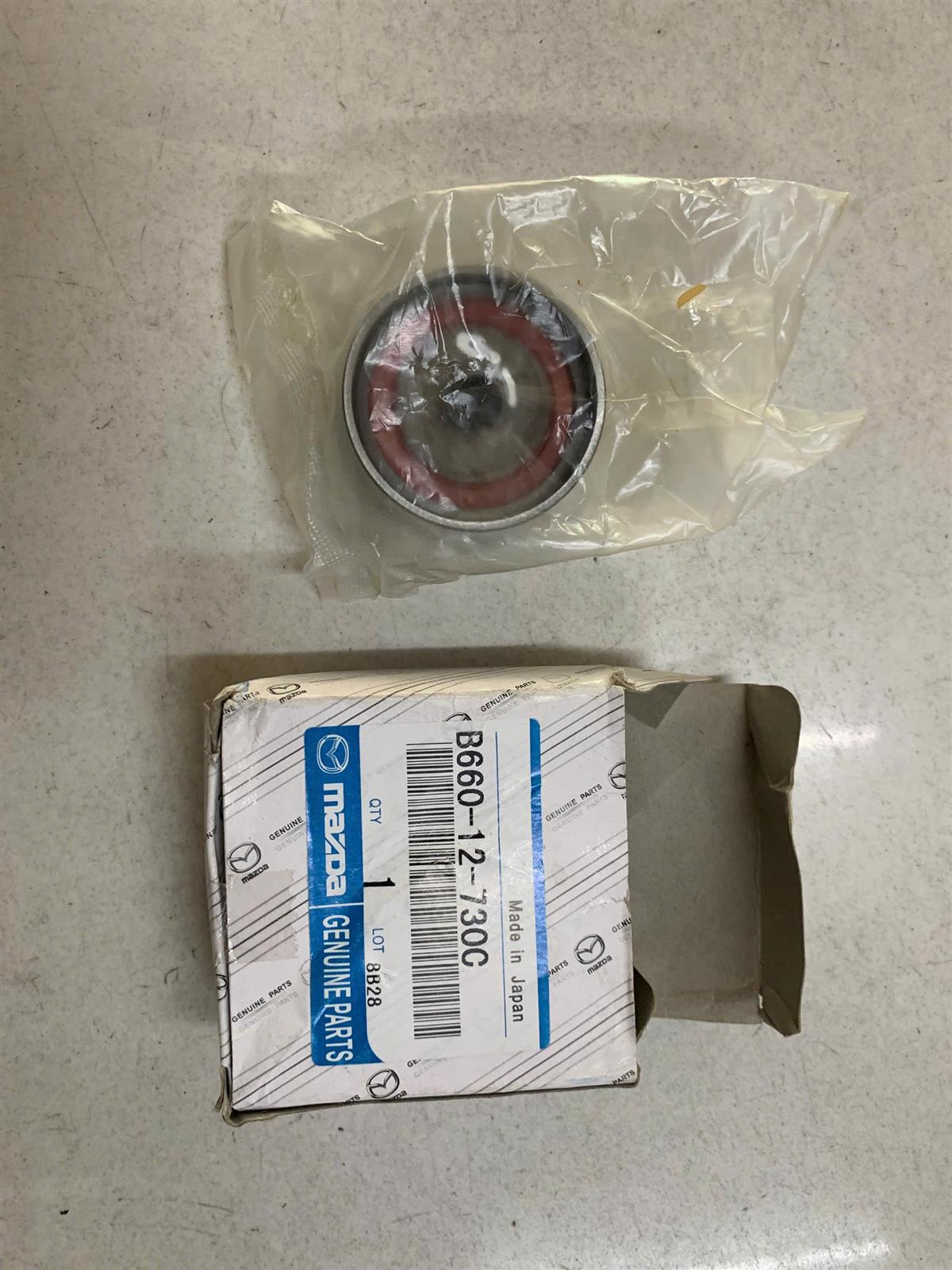 Puly đỡ cam Ford Laser 2003 đỡ (Tỳ cam) 